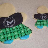 Kilted Cookies! I made a bunch of these for a raffle at a Scottich Highland games! NFSC with glace icing! The logo on the shirt is the same logo on the t-...