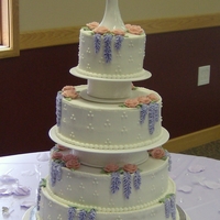 Wisteria And Roses My first "wedding" cake; actually for a wedding themed ladies tea. 14, 12, 10, & 6 inch tiers; mixed berry filling; all...
