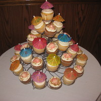 Beach Theme Banana cupcakes with creamcheese frosting and white cupcakes with keylime filling and vanilla buttercream. white chocolate sea shell...