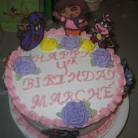 Dora & Friends Similar to the first CT cake that I did. 2 layer 9 inche round cake. Figures are CTs, RI flowers, and BC icing. Thanks for looking! ;)