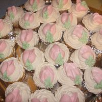 Rosebud Cupcakes My teenage daughter made these for her friends for Valentines day. She is a dishwasher at a bakery and watches the decorator, she has read...