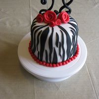 Img_0980.jpg Does anybody know how to keep the fondant numbers standing up? Mine had to be propped up with the ugly wires.