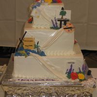 My Favorite Things Three Tiered Square cake. Fondant numerals brushed with luster dust for topper. Fondant drape down front of cake. Corners decorated with...