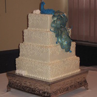 Peacock Wedding Cake This four tiered, buttercream iced wedding cake was inspired by ozcake's award winning peacock and khoudek's beautiful scroll...