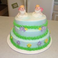 Angel Birthday Cake The angels and flowers are fondant,buttercream frosting and carrot cake.