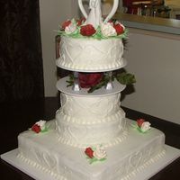 First Wedding Cake My very first wedding cake!!! The cake is white with raspberry filling, BC frosting and gum paste flowers. Thanks for looking.