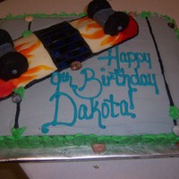 Skateboard Buttercream icing with fondant skateboard. RCT decks and wheels, painted board.