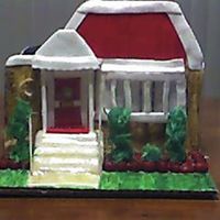 House.jpg This cake was a mini replica of a house a friend purchased...this was the first house I've done would have liked the stucture to be...