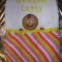 Baby Shower Cake I made this for someone at work. I used the Wilton Bookpan. Colors in the blanket did not come out as nice as I wanted.