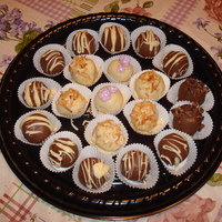 Cake Balls what else do you do with cake scraps?!?!!?chocolate with white chocolate drizzle white chocolate with fondant flower and sugar pearl...