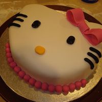 Hello Kitty Cake cake for my mom's birthday! she loves and collects anything hello kitty! pineapple cake with buttercream and fondant