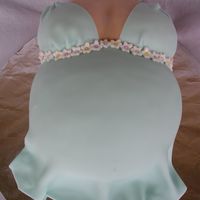 Pregnant Belly With Blue Dress This cake was for a baby shower. The baby is going to be a boy, so she is wearing a blue dress. All fondant covering chocolate cake with...