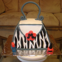 My First Purse Cake This is very similar to another purse cake I found on CC. It was so much fun. BC with MMF accents.