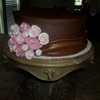 Roses And Fondant Sash This is iced in chocolate fudge buttercream. Roses are gumpaste, and the sash is brown fondant. I love this cake! I found it on here, but...