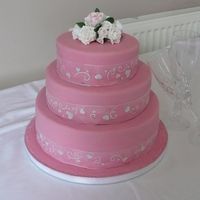 Pretty In Pink Fondant iced with petal paste roses.TFL