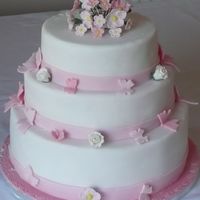 Spring Wedding Chocolate sponge, orange sponge and madiera. Flowers made of petal paste, butterflies gumpaste, and the rest iced in fondant.