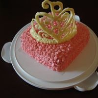 Tiara Orange cake with white chocolate tiara. Thank you all who shared their talents on how to acquire a tiara. Thanks for looking!