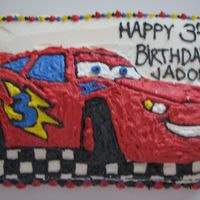 Disney Cars Birthday Cake I used the Cars cake pan, and sliced the top off where the design baked- about 1/2 inch of cake. I baked a regular rectangle cake, and...