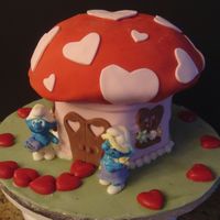 Smurfy I've been dying to make a smurf cake ... this is a replica of their mushroom house for Valentine's Day, with smurf figures made...