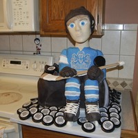Bobble Head Hockey Cake For my son's end of year hockey banquet ... a hockey player sitting on top of his hockey bag! The head on the player actually bobbles...