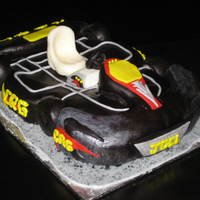 Go Cart Cake Marshmallow fondant, Chocolate Italian Buttercream,Chocolate Cake carved from a two-layer 9x13, Silver dust, Seat make from carved white...