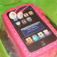 Ipod Cake Vanilla cake with chocoale buttercream filling. Fondant covering and details with black 'page' printed out onto edible paper,...