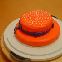 First Cake -- Red Hat I made this cake for my mom's friend who is turning 50 this weekend. My mom is doing the whole red hat w/purple thing for her party....