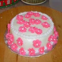 Birthday Cake I made this cake for my step mom. It's my first time making those flowers. It's fondant with buttercream flowers and star border...