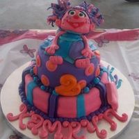 Abbydabby.jpg Abby Cadabby themed birthday cake. Yellow cake, all fondant. Abby was made using fondant as well.