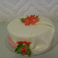 Merry Christmas Cake With Holly And Poinsettas This is a chocolate cake frosted with buttercream, and covered with fondant. The flowers and drape are also fondant. I also added some...