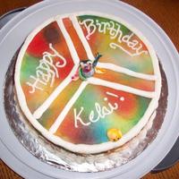 Peace Frog Cake I think it is just a Funfetti cake with buttercream frosting. The little frog and smiley face are fondant.