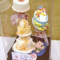 Wilton Instructor's Meeting July 2006 - First Place This is a cake display I made for the contest held at the Raleigh NC Wilton Method Instructors Annual Meeting. The contest rules said to...