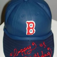 Red Sox Cake Chocolate cake-Caramel SWMB; Fondant and gum paste designs. I used &acirc;6 cake pan & half of the welton ball pan. Brim is gum...