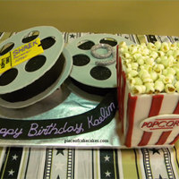 Movie Time the cake was the popcorn container and the inside of the movie reel. reels were gumpaste. popcorn was fondant.