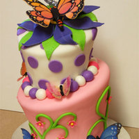 Butterfies Chocolate and yellow cake. Butterfies were printed on rice paper. Fondant covered cakes and fondant decorations.