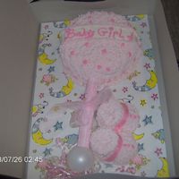 Baby Shower It's A Girl shoes and baby rattle for a girl baby shower.