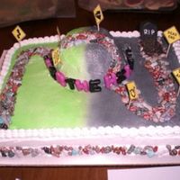 Over The Hill BC icing airbrushed. rock candy used for trail, crushed oreos for the grave, and fondant tombstone.