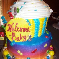 Candy Shower candy themed baby shower cake. cupcake on top of and 8"round both yellow cake