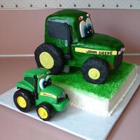 Johnnie Tractor Covered this tractor with MMF. All detailing is MMF. The tires are rice krispy treats covered with fondant. The small Johnnie tractor was...