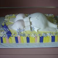Baby Shower I got 2nd place at our Fulton County Fair with this cake. The base is bc, the belly is half of a sports ball pan and two coconut snowballs...