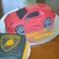 Lamborghini What a nightmare! My husband's great idea was to cover the cake in black fondant and then another layer of red fondant. He wanted to...
