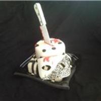 Haunted Masqurade The knife and Mask my husband made out of a sugar mixture. This cake was for a Halloween Party.