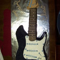 Guitar Birthday replica of a young boys guitar all done in cake. the entire cake is piped in buttercream. The guitar strings are embroidery floss. The...