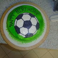 Soccer Cake This is a rainbow cake with a FBCT on it.