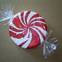 Peppermint Patty 8" round covered in MMF. The stripes are painted w/ red food color. I wrapped it in cellophane to look more like a candy. (Plus the...
