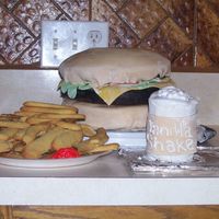 Dad_Cakes_Clothes_033.jpg My first burger, fries and shake. Still a nubie makin many mistakes. Fries are sugar cookies. Burger is italian cream cake covered n...