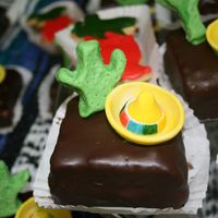 Mexican Mini 24 mini vanilla cakes with praline butter pecan filling, dipped in chocolate ganache for teacher appreciation luncheon. Sugar paste hand...