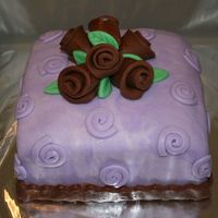 Coco Roses A La Lavendar 6" square covered in MMF with Chocolate MMF roses and ribbon. Just practicing.
