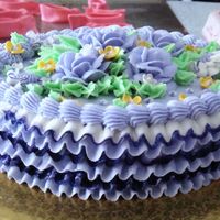 Ruffles & Roses Birthday Cake The ruffles on the side were done with a rose tip. I accidentally put too much dye into the bag in an attempt to accent the edges--oops!!...