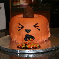 Sick Pumpkin My second cake. Yellow cake, fudge/BC icing, MMF. Stem is RKT covered in fudge/BC icing. For some reason my fondant always folds like that...